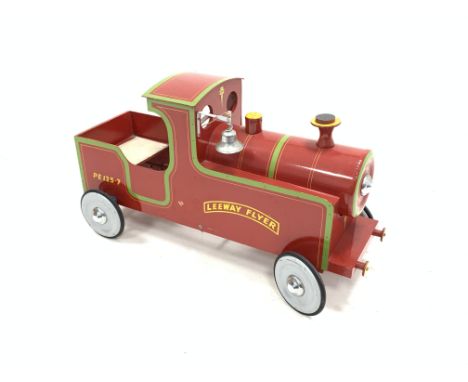 Child's Leeway pedal car modelled as a steam engine, the side reading 'PE 125.7 Leeway Flyer', complete with string pull bell