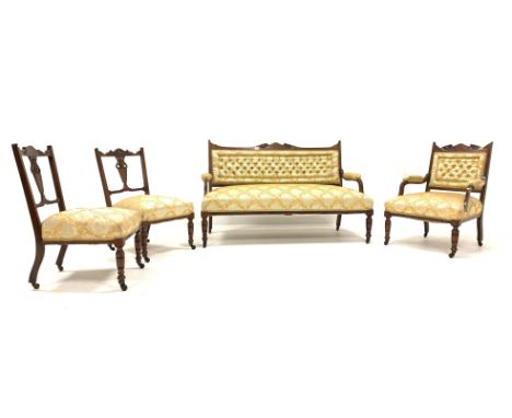 Edwardian rosewood four piece drawing room suit, comprising of a three seat sofa, carved cresting rail with scrolled floral b