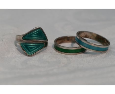 A pair of Norwegian silver and enamel band rings and a similar Norwegian silver and enamel dress ring, sizes L,L &amp; M