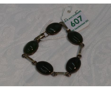 A  five stone Jade style cabouchon bracelet in collared mounts with HM silver interconnecting bars and clasp, approx 7'