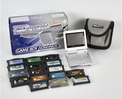 NINTENDO Gameboy Advance SP bundle + 16 loose games in a tin Includes: Gameboy Advance SP Console (silver) in official travel