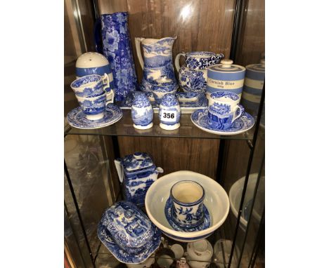 TWO SHELVES OF BLUE AND WHITE TRANSFER PRINTED WARES INCLUDING RINGTONS TEAPOT, COPELAND SPODE, TG GREEN FLOUR SIFTER