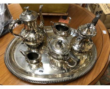 ELECTRO PLATED FOUR PIECE TEA/COFFEE SERVICE ON BEADED OVAL TRAY ALONG WITH AN ELECTRO PLATED ROCCOCO STYLE COFFEE POT