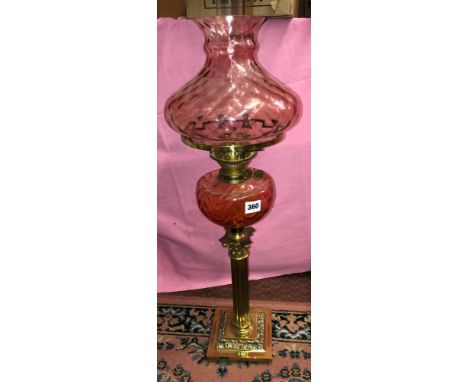 BRASS CORINTHIAN COLUMN OIL LAMP WITH RUBY RESERVOIR AND SHADE