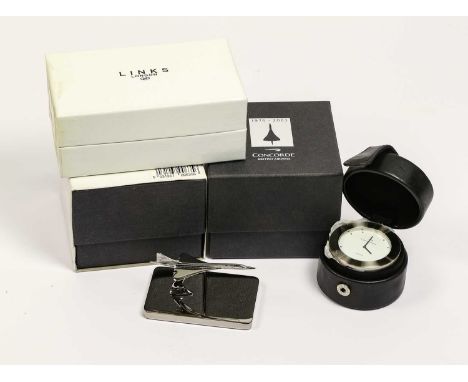 two Alarm Clocks in leather cases; Links Concorde paperweight and Alarm clock; Cross two pens; five Port Decanter tags; lugga