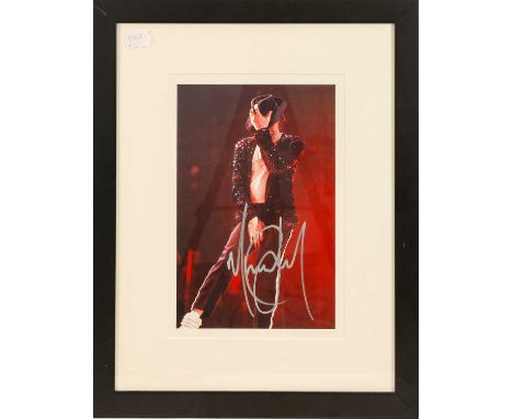 signed in silver pen, with certificate of authenticity verso and paper label 'Michael Jackson Narita International Airport Ma