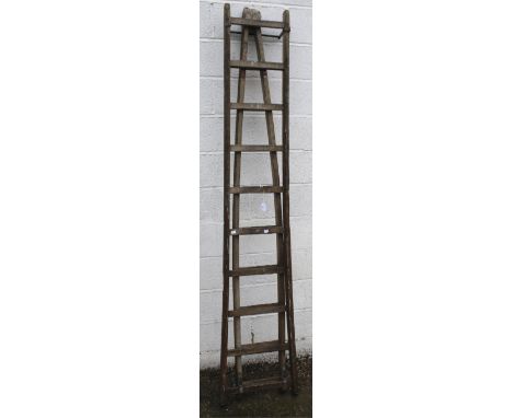 A vintage wooden window cleaner's two section ladder. 