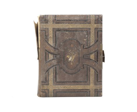 A Victorian musical photograph album. Containing a collection of Victorian and later portrait photographs, mostly carte de vi