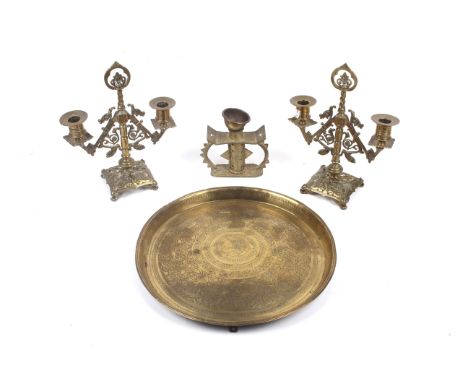 An assortment of 19th century and later brassware. Comprising a pair of candlesticks, a singular candlestick and a circular t