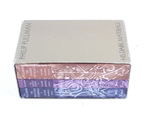 A boxed set of signed first edition trade paperbacks of Philip Pullman's 'His Dark Materials' series. Published in the USA by