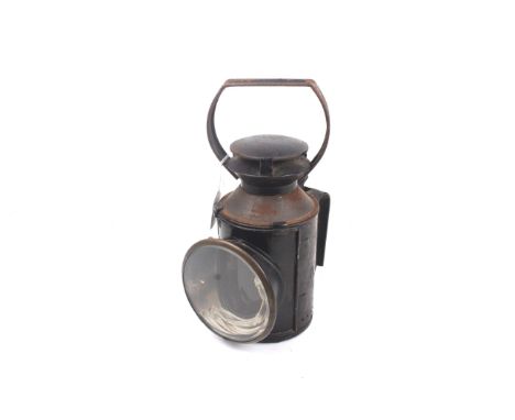 A vintage British Railway train signal lamp. Stamped 'B R', with red, blue and clear glass lenses and a burner. H28cm