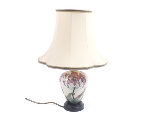 A contemporary Moorcroft ceramic lamp. The tube-lined decoration in the 'Fly away home' pattern, on a circular base with a cr