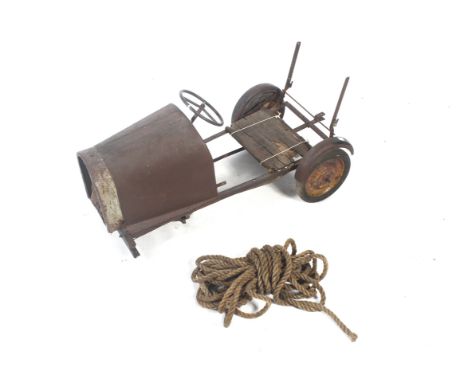 A vintage toy part pedal car. With metal bonnet, steering wheel and rear wheels, L92cm. Plus a length of old rope. 