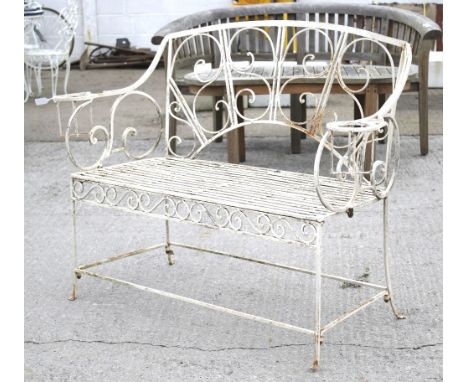 A 20th century wire-work garden bench. With an arched back and scrolling decoration to the frame, H91.5cm x W125.5cm x D46cm