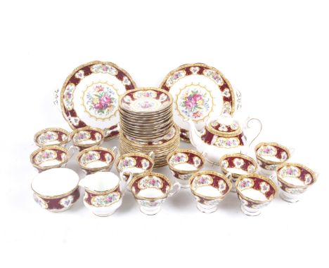 A twelve setting Royal Albert porcelain tea service. In the 'Lady Hamilton' pattern, including a teapot, cups and saucers, si