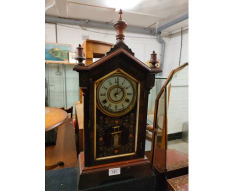 19th century ornate clock with Barrell pendulum. 