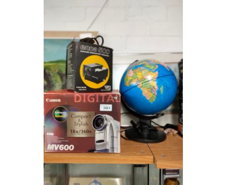 Boxed digital camera , globe together with other item. 