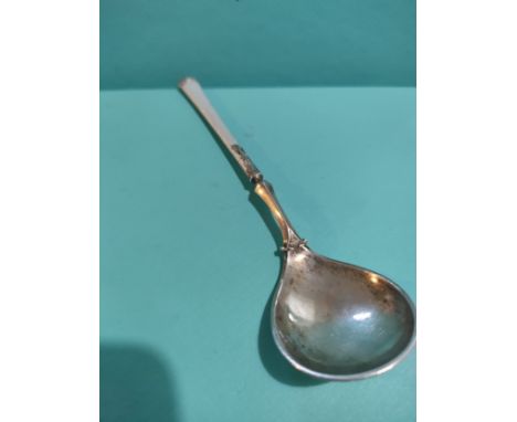 Heavy silver and enamel spoon. 