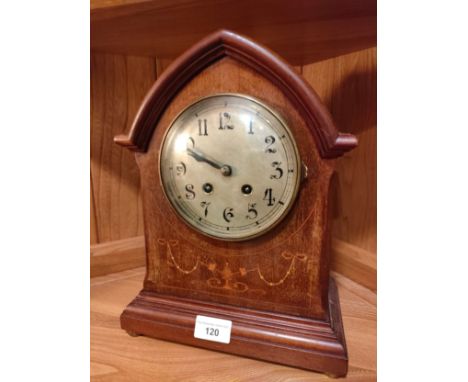 Edwardian clock with key and pendulum. 