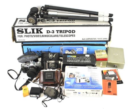 An assortment of cameras and related accessories. Including a Polaroid PDC 5350 a Niddin 360TW Flash Unit, a Veibon cx 640 tr