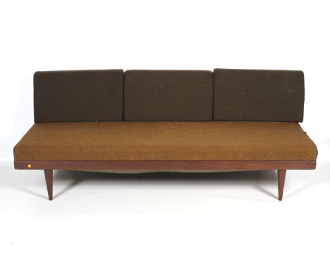 A vintage Danish style sofa - day bed. With teak frame and brown back rest cushions and a seat cushion, on tapering conical l