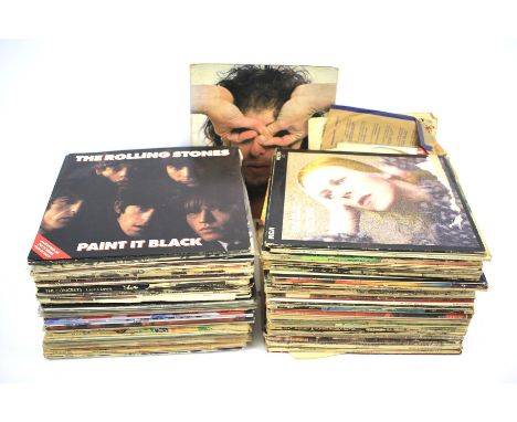 A large collection of vintage vinyl. Including The Beatles, Pink Floyd and Eric Clapton, Elton John, Diar Straits, Bob Dylan,