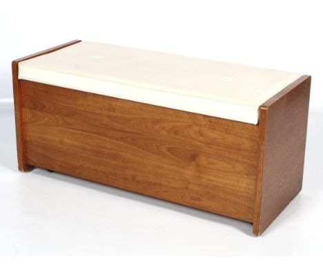 A mid-century teak storage bench. The hinged top with padded seat, all raised on casters. L97cm x circa D47cm x H44cm