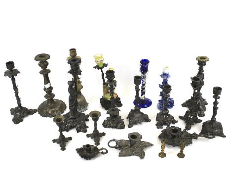A group of late 19th-early 20th century spelter, white metal and brass candlesticks. Various stamped marks, Including figural