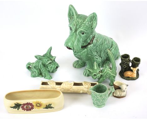 Eight items of Sylvac pottery. Impressed marks. Including: a large model of a green glazed Scottie dog, 32cm high, another sm