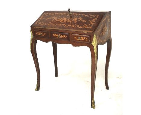 A reproduction 19th century Dutch style Inlaid fall front bureau. The fall enclosing an elongated shelf above three drawers. 