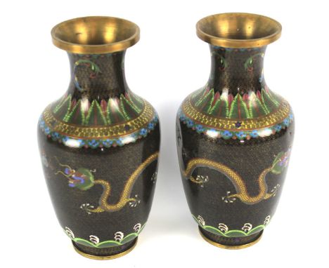 A pair of 20th century Chinese cloisonne enamel oviform vases. Decorated with scrolling dragons chasing a flaming pearl on a 