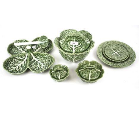 A group of vintage Majolica Bordallo Pinheiro cabbage leaf ware. Including plates, condiment dishes, lidded tureen, ladle, et