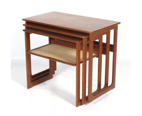 A mid-century, Danish teak nest of tables. Johannes Andersen &amp; Illum Wikkelso for CFC Silkeborg. The smallest tier with r