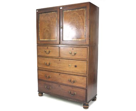 An early 20th century mahogany storage cabinet, converted compactum. With one shelf behind double doors, with two over three 