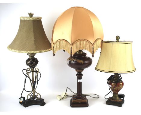 Three assorted table lamps with shades. Including a converted oil lamp with ceramic reservoir, H78cm, and one of architectura