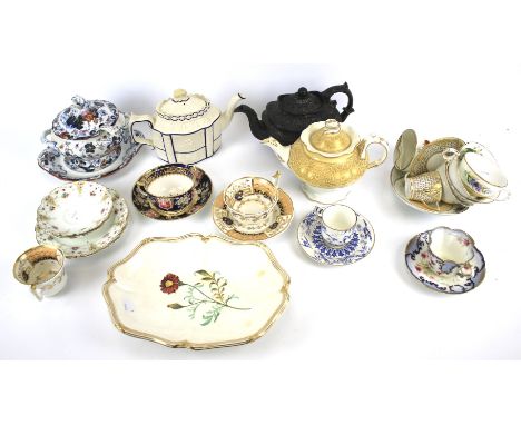 Assorted 19th century porcelain teawares. Including: a blue-ground teacup and saucer painted with flowers, a Staffordshire fo