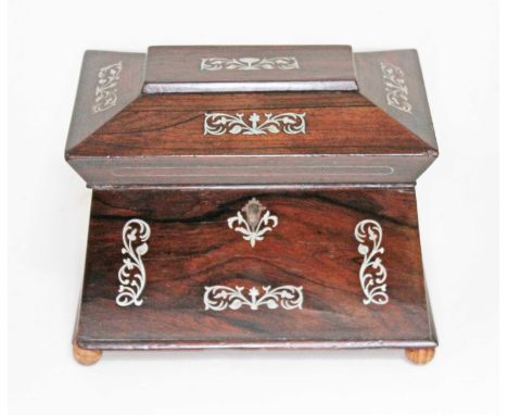 A 19th century mother of pearl inlaid rosewood tea caddy of sarcophagus form, length 23.5cm.  