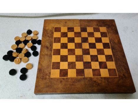 A folding walnut chess board with internal backgammon set.Condition:- General wear through age and use, light scratches to su