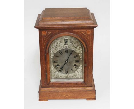 An oak cased steel dial mantle clock with striking movement, height 35cm.Condition:- Not tested, sold with no guarantee.
