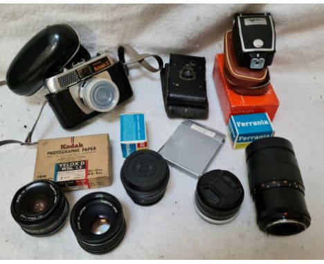 Assorted camera equipment including five lens, an Eastman Kodak A-127, a Prinz Mastermatic III, 1960s films etc.Serial Number