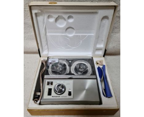 A vintage Westinghouse miniature tape recorder with earphone and batteries, boxed.  
