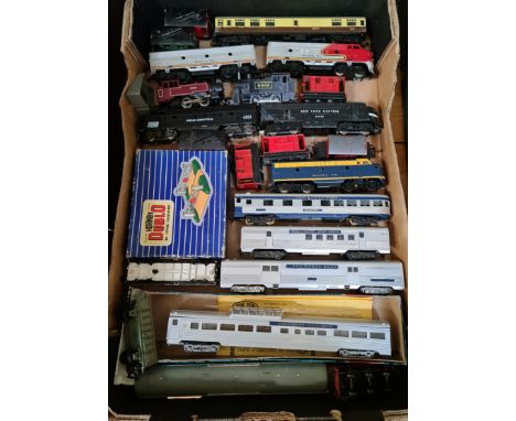 A box of model railway locomotives and coaches.  