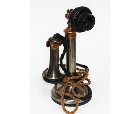 An early 20th century candlestick telephone.  