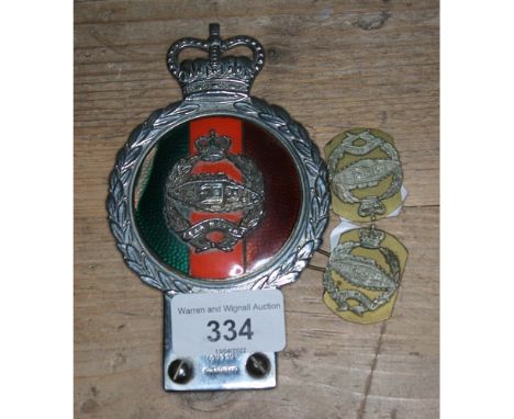 A Royal British Tank Regiment vehicle badge by J R Gaunt London and two similar badges.  