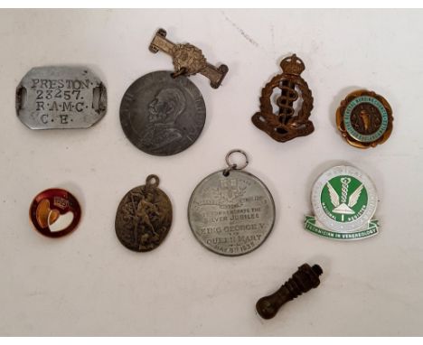 A collection of badges and medals awarded for services, including medical auxiliary and an aluminium military tag "Preston 23