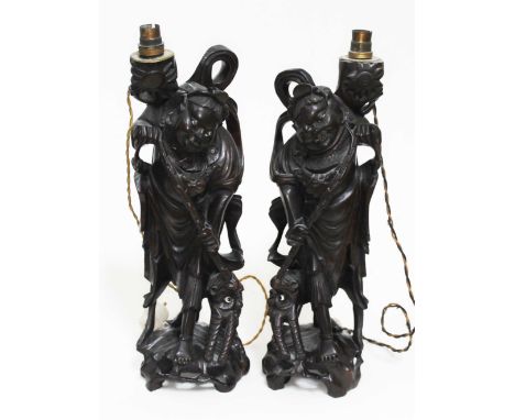 A pair of Chinese carved hardwood lamp bases, height 46cm.  