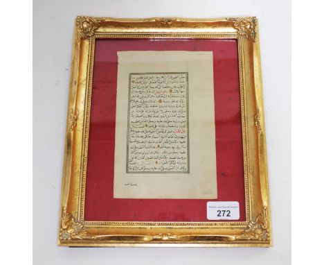 An Islamic manuscript, glazed and framed in gilt frame.  