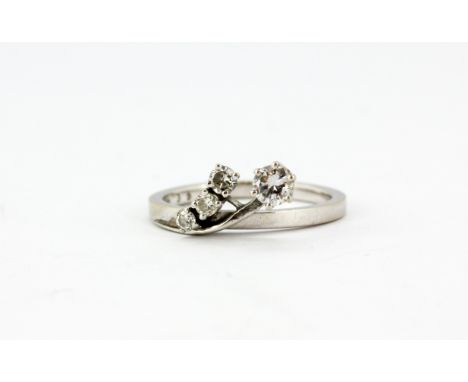 A 14ct white gold (stamped 585) ring set with brilliant cut diamonds, (K).