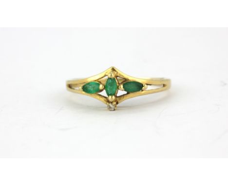 A 9ct yellow gold emerald and diamond set ring, (M).