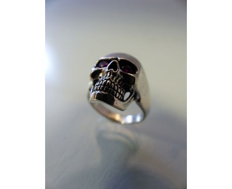 Silver skull ring with ruby coloured eyes